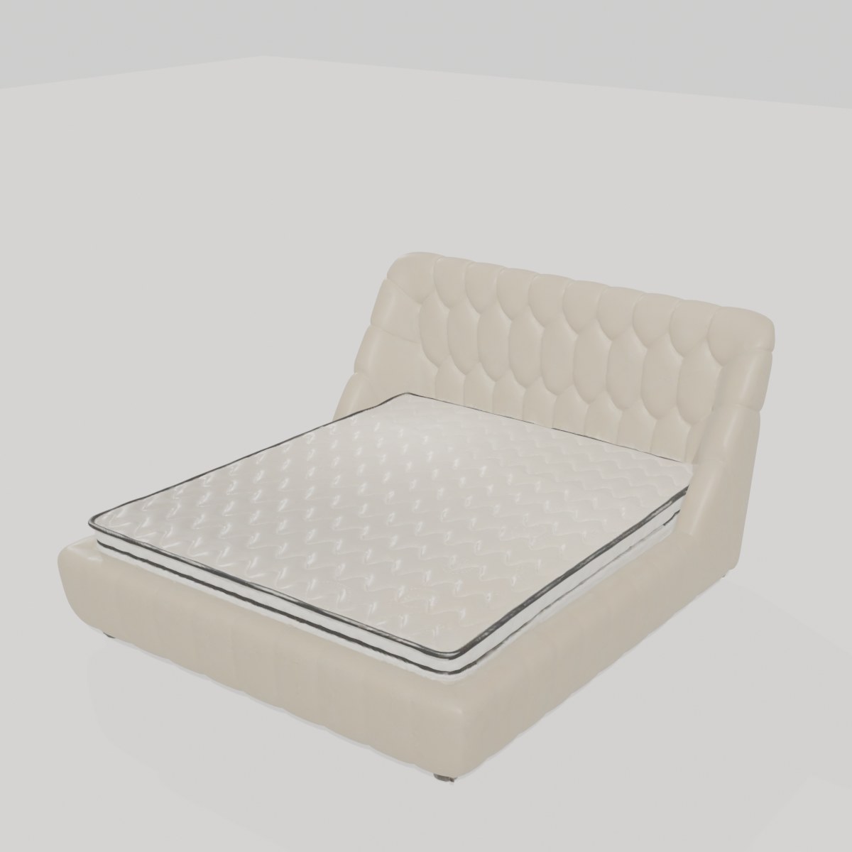 Cream upholstered bed with a deeply buttoned tufted headboard and a quilted mattress