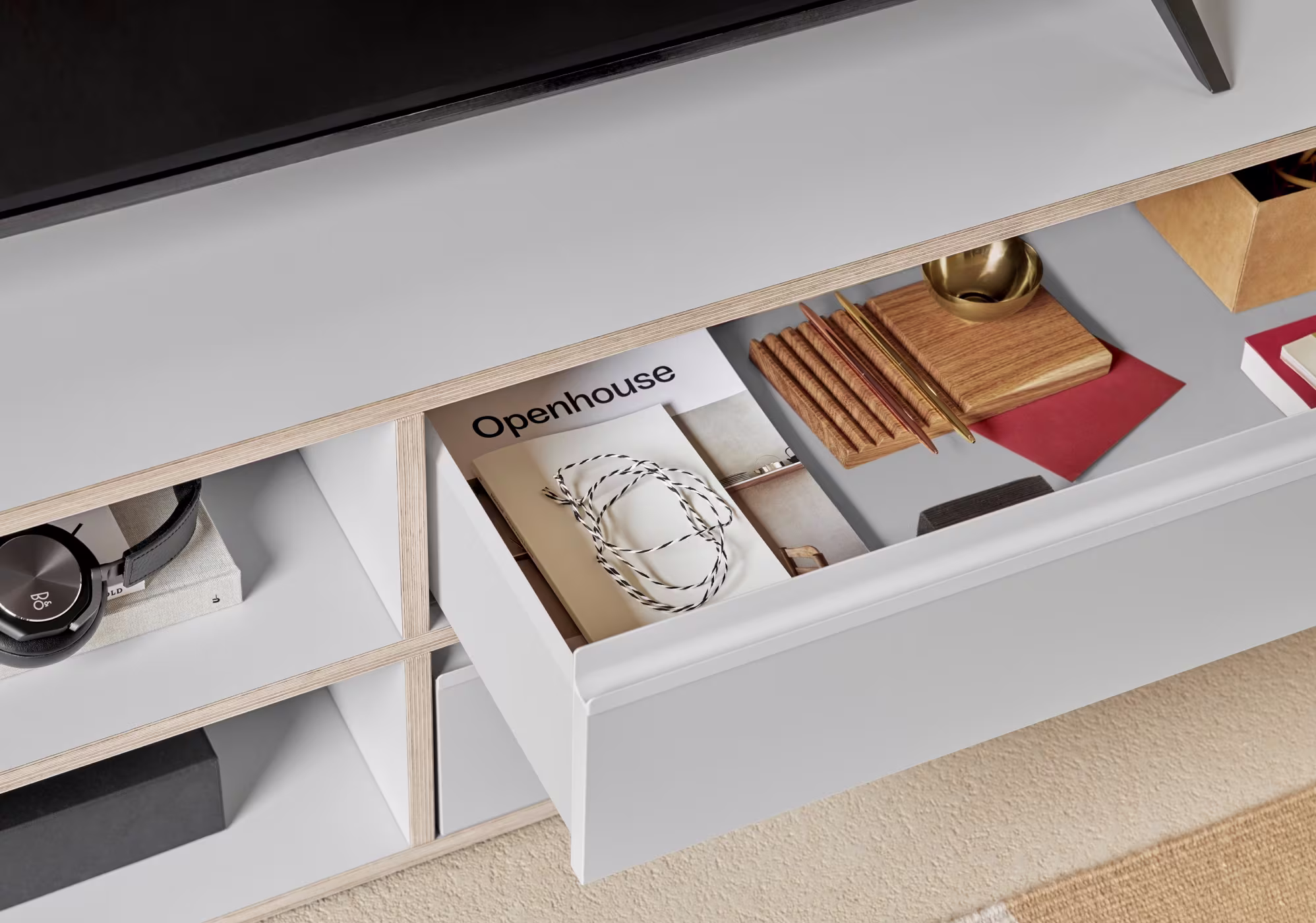 A TV stand in a furnished room